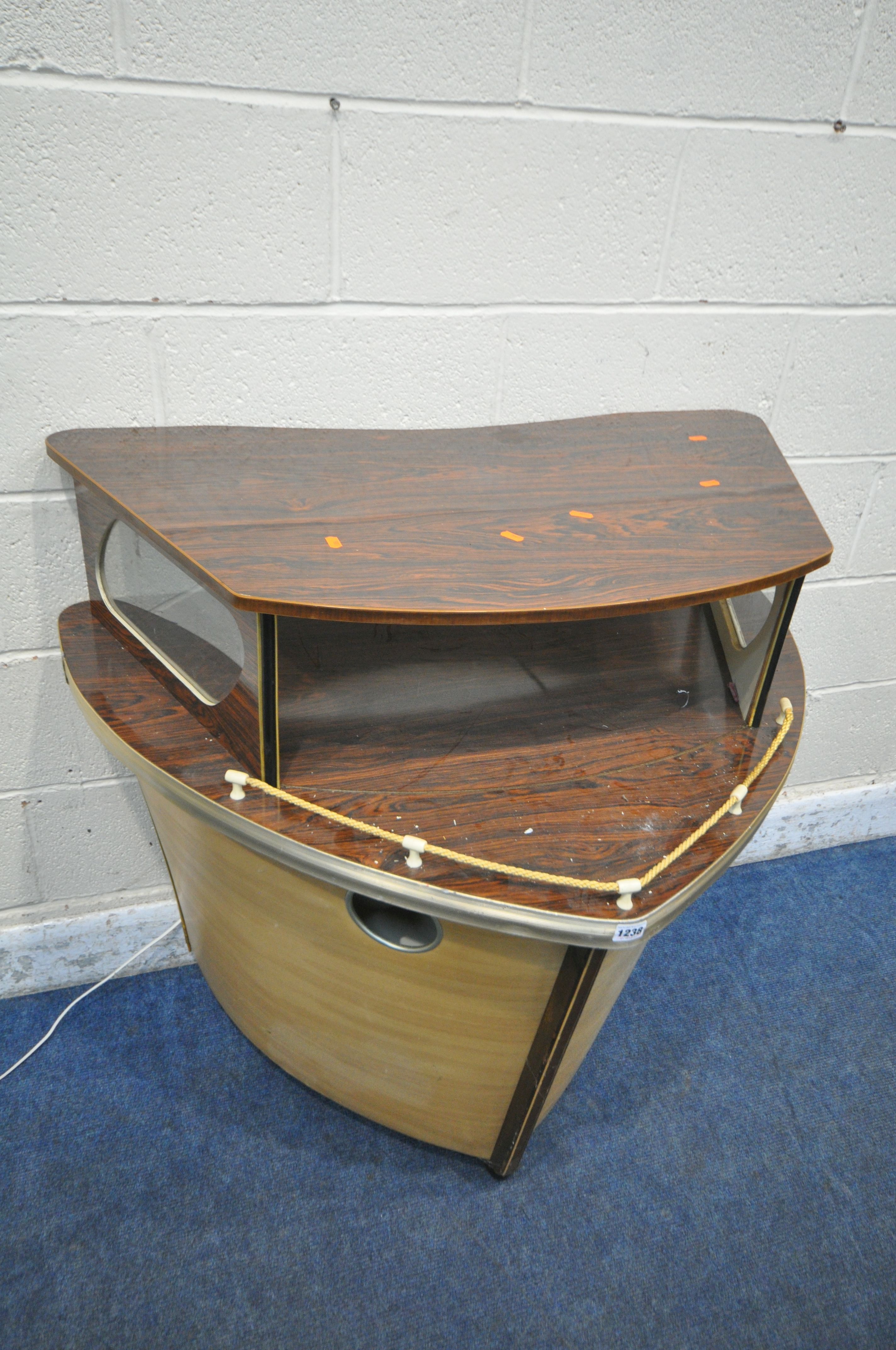 A MID CENTURY COCKTAIL BAR, designed in the shape of a boat front, with simulated rosewood top, - Image 2 of 6