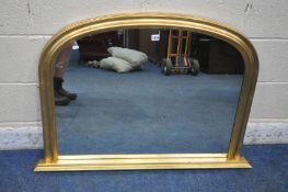A GILT FRAMED ARCHED OVERMANTEL MIRROR, width 108cm x height 76cm (condition report: general signs