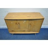 LUCIAN ERCOLANI, ERCOL, A MID CENTURY ELM AND BEECH SIDEBOARD, fitted with three cupboard doors
