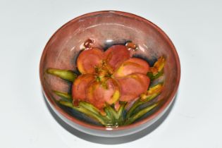 A MOORCROFT POTTERY FLAMBE FOOTED BOWL DECORATED IN THE FREESIA PATTERN, impressed marks, diameter