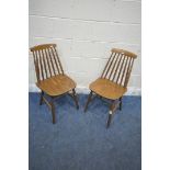 A PAIR OF ERCOL STYLE SPINDLE BACK CHAIRS (condition report: general signs of wear and usage) (2)