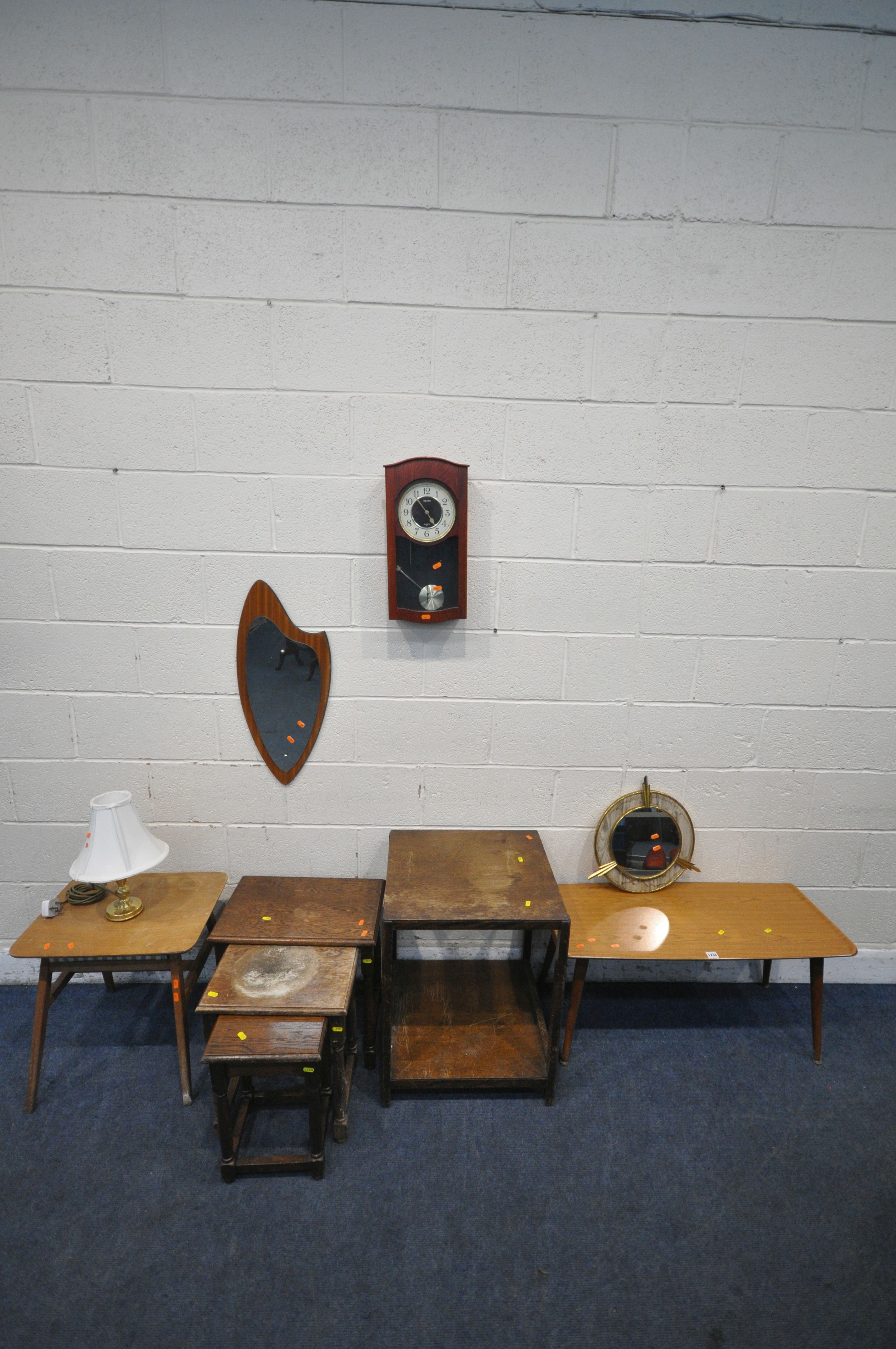 A MID CENTURY TEAK EFFECT COFFEE TABLE, with cylindrical tapered legs, width 92cm x depth 41cm x