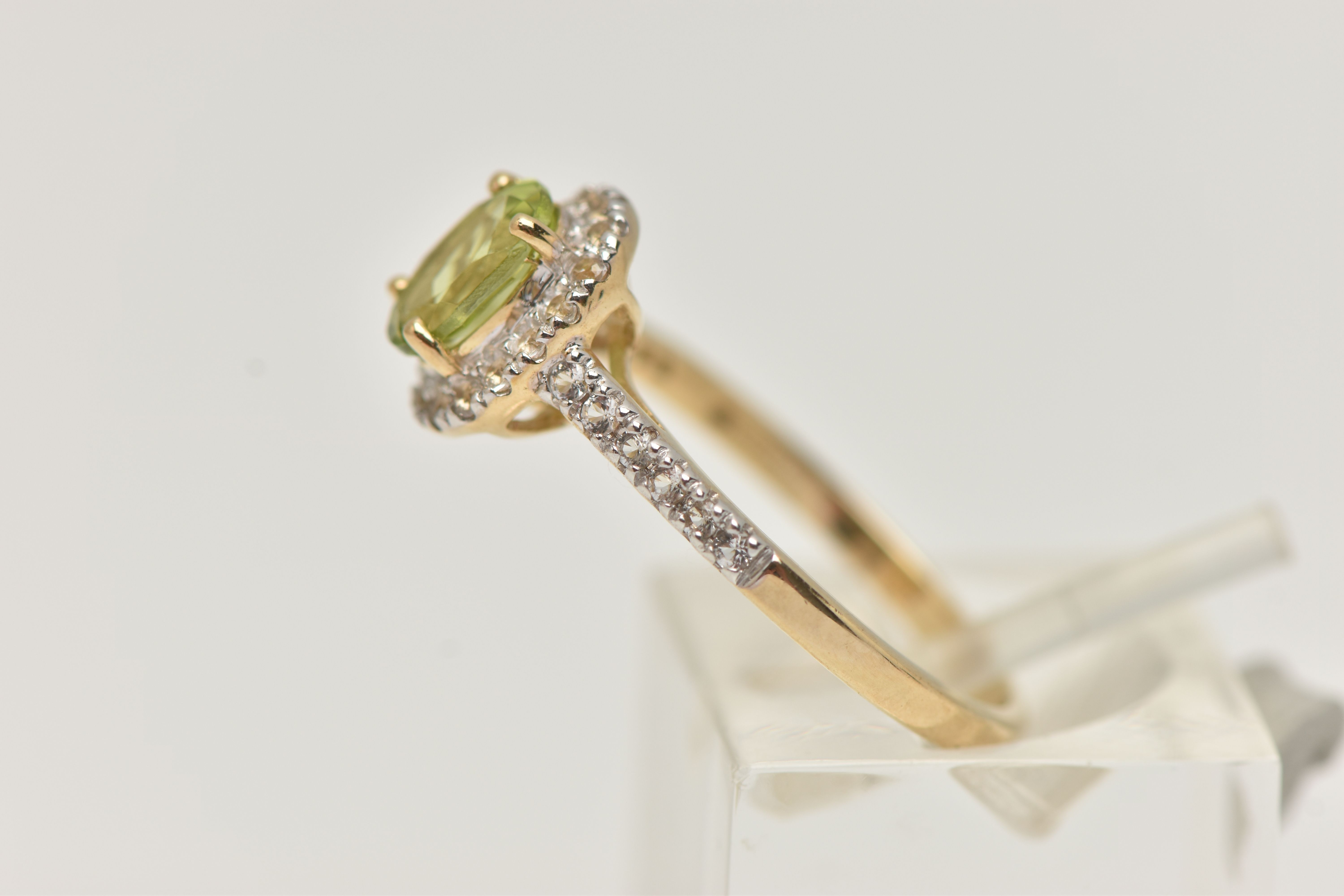 A 9CT GOLD PERIDOT DRESS RING, a principally set oval cut peridot, prong set in yellow gold, set - Image 2 of 4