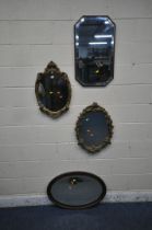 TWO GILT RESIN WALL MIRRORS, with cherub and foliate details, larger mirror 64cm x 48cm, a