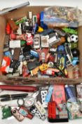 A BOX OF ASSORTED ITEMS, to include various novelty lighters, in forms such as a phone, chocolate,