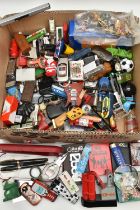 A BOX OF ASSORTED ITEMS, to include various novelty lighters, in forms such as a phone, chocolate,
