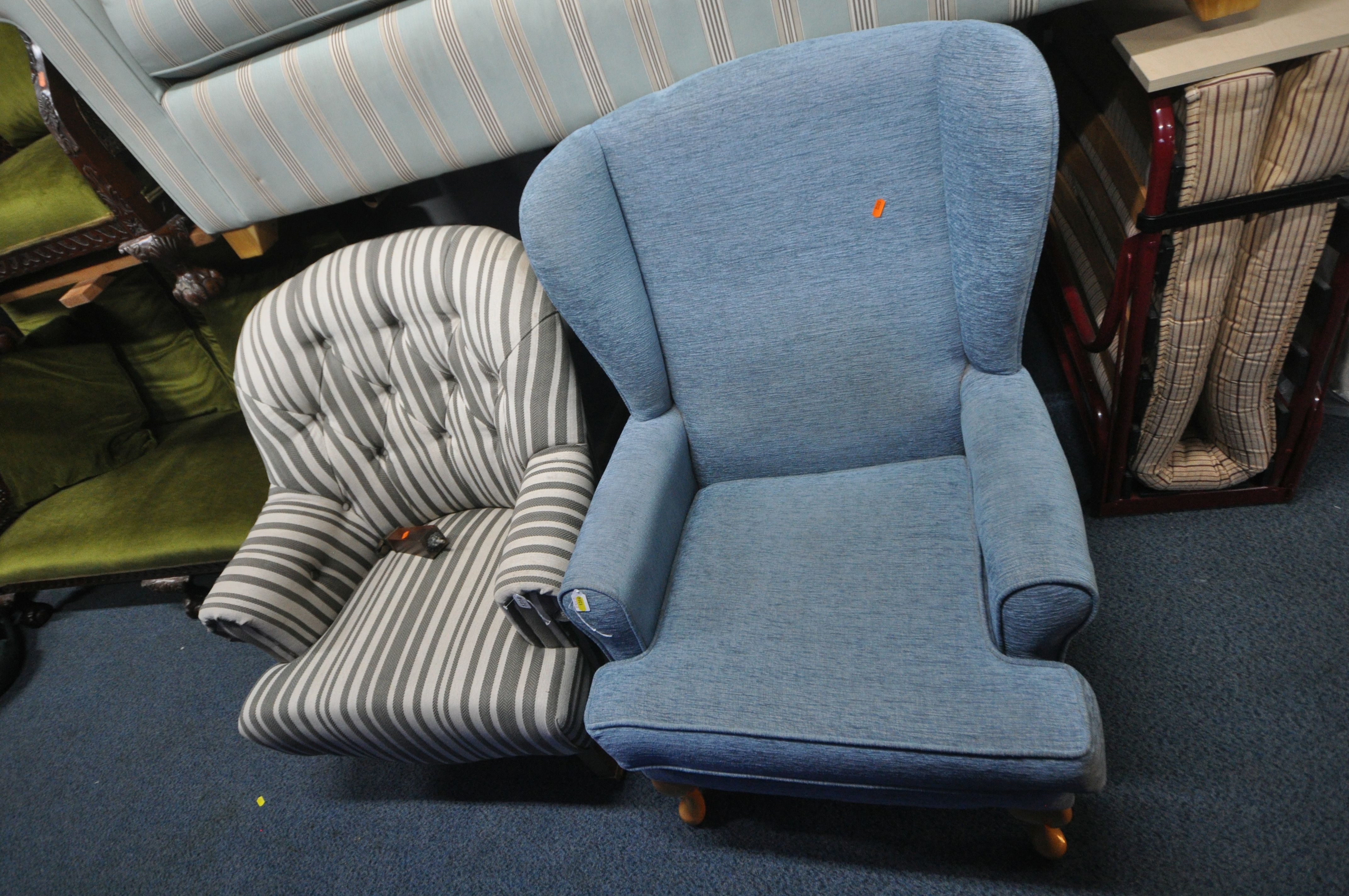 AN ART FORMA STRIPPED BUTTON BACK CHAIR, along with a blue wing back armchair (condition report: one