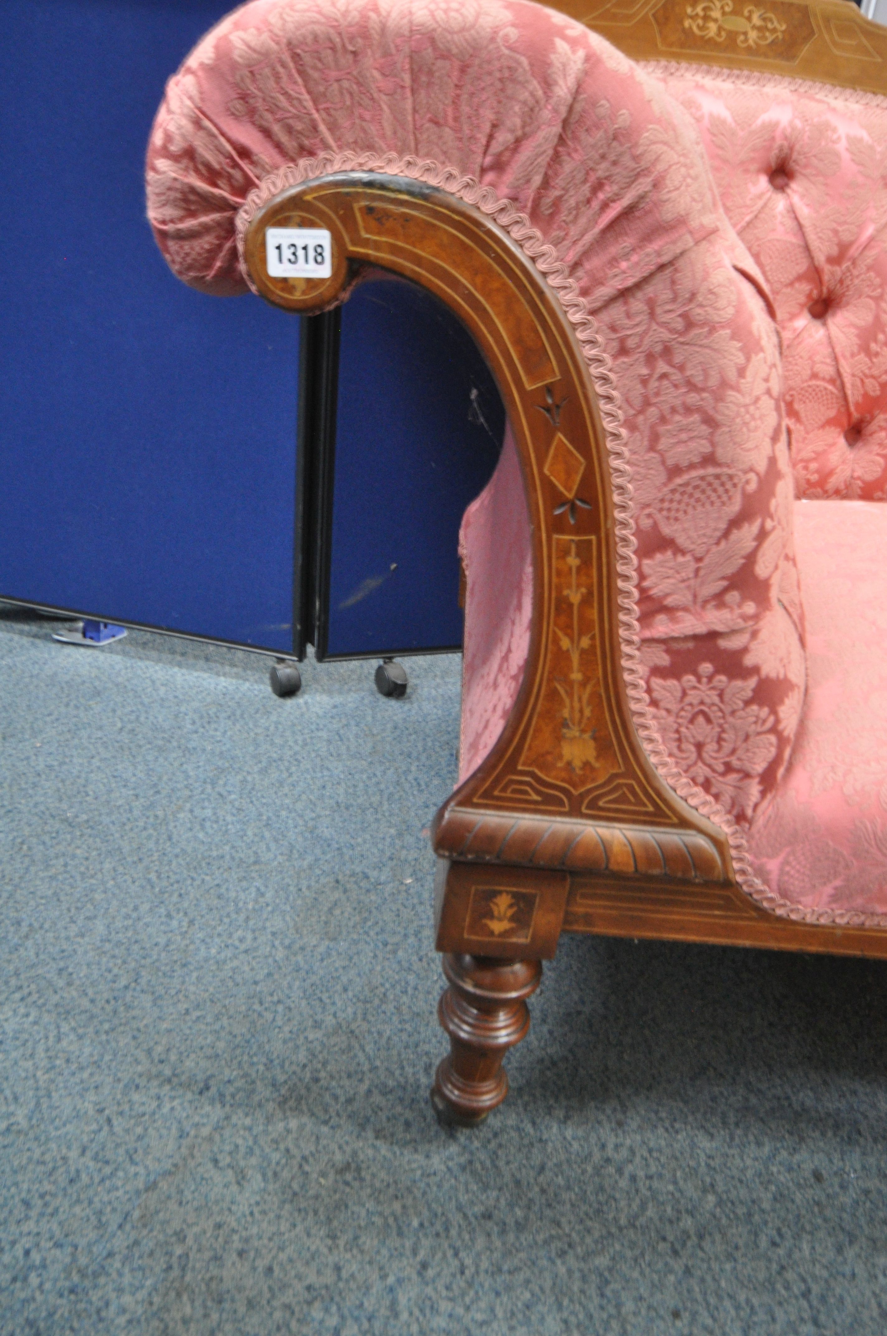 A LATE VICTORIAN WALNUT AND INLAID CHAISE LOUNGE, with pink and floral upholstery, raised on - Image 2 of 4