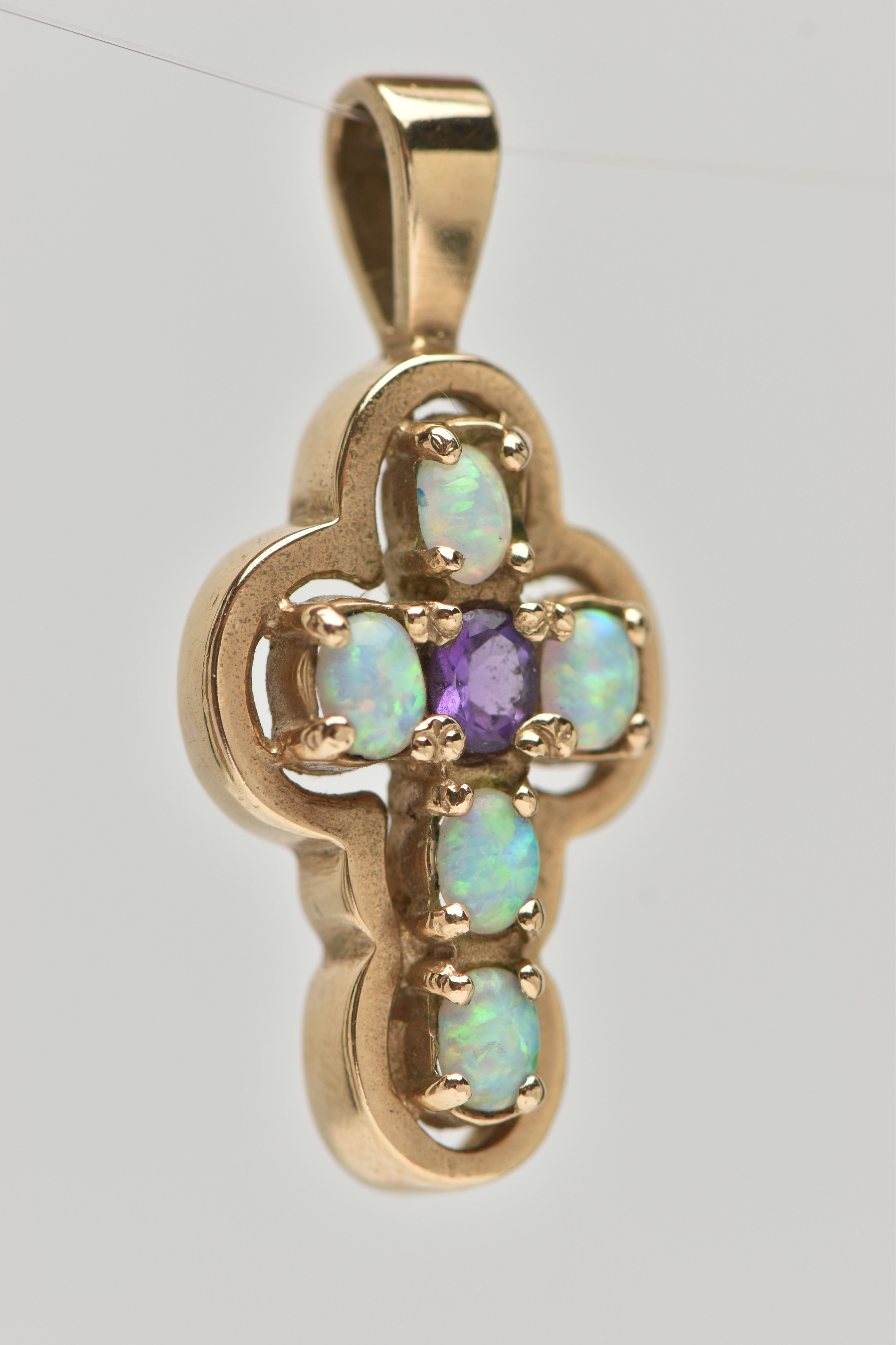 A 9CT GOLD AMETHYST AND SYNTHETIC OPAL CROSS PENDANT, set centrally with an oval cut amethyst, and - Image 3 of 4