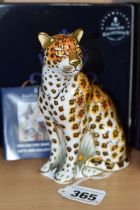A BOXED ROYAL CROWN DERBY 'LEOPARDESS' PAPERWEIGHT, with gold stopper, red printed backstamp and