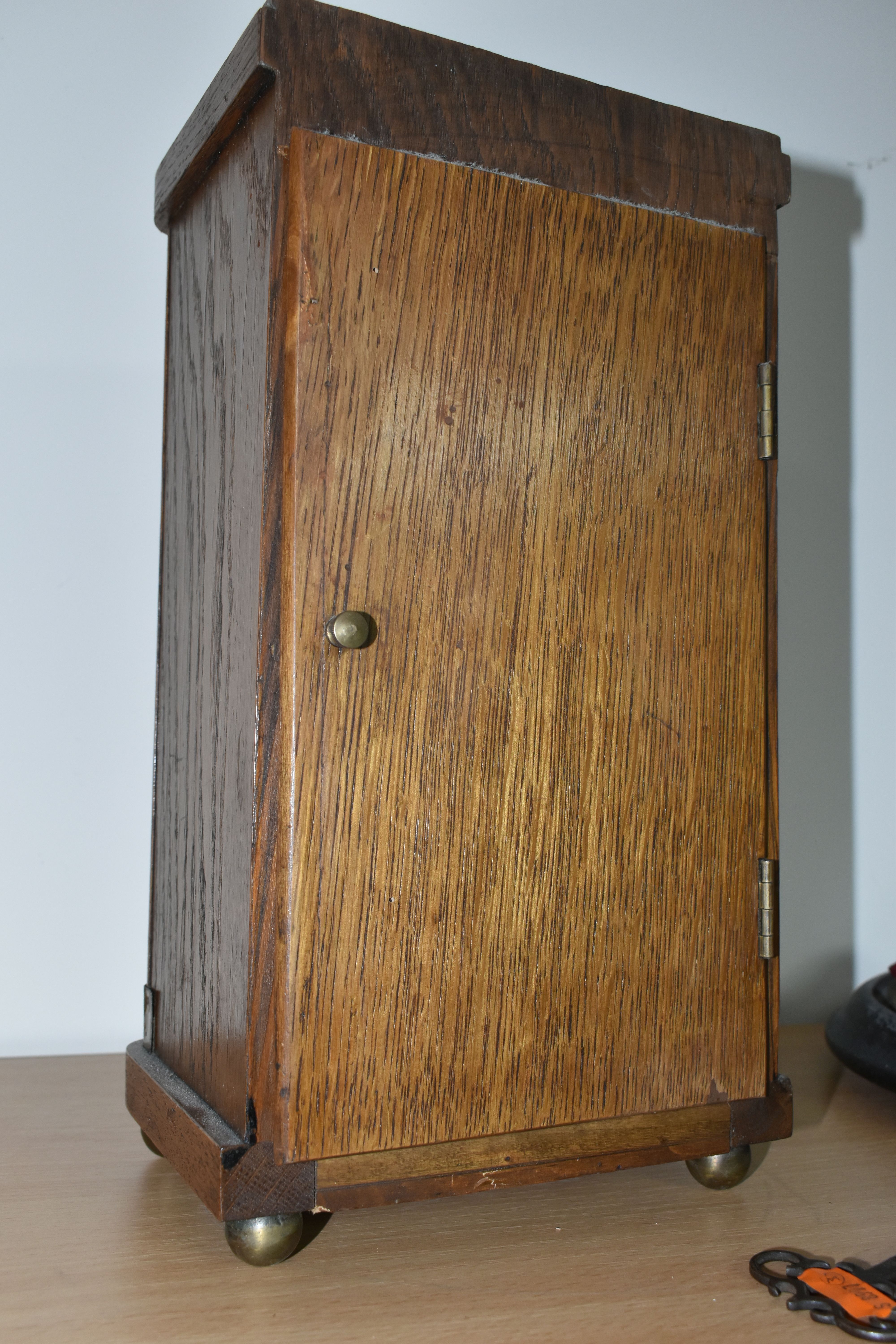 A JUNGHANS TABLE CLOCK, a plane oak case, striking gong, half hour and hour, supported by four - Image 4 of 5