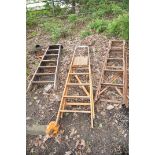 THREE VINTAGE WOODEN STEP LADDERS including one with lattice sides 145cm high (3)