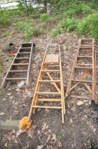 THREE VINTAGE WOODEN STEP LADDERS including one with lattice sides 145cm high (3)