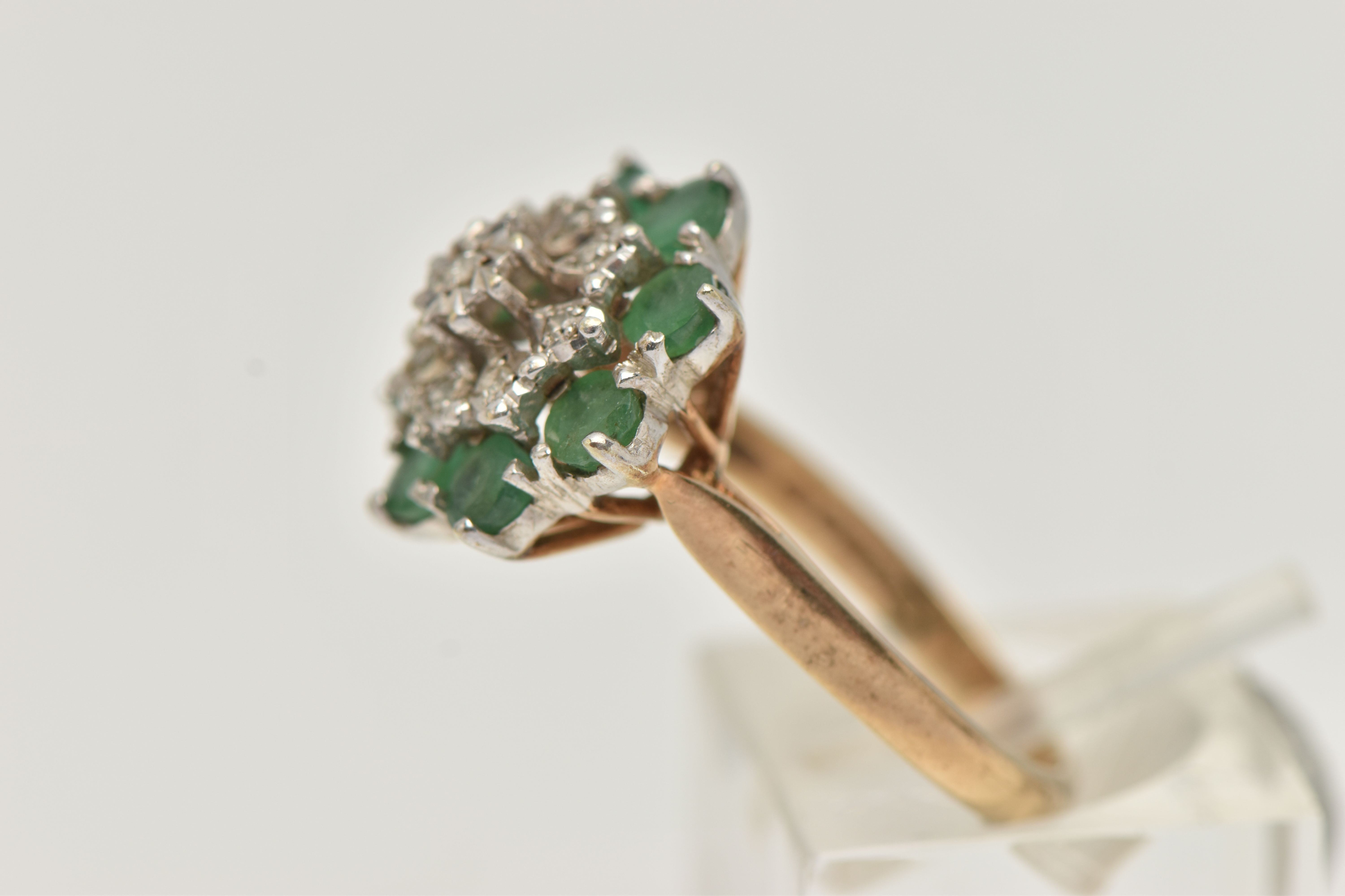 A 9CT GOLD EMERALD AND DIAMOND CLUSTER RING, tiered cluster set with nine illusion set single cut - Image 2 of 4