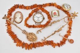 A BAG OF ASSORTED JEWELLERY, to include a copal amber bead necklace, 'Halycon Days' commemorative