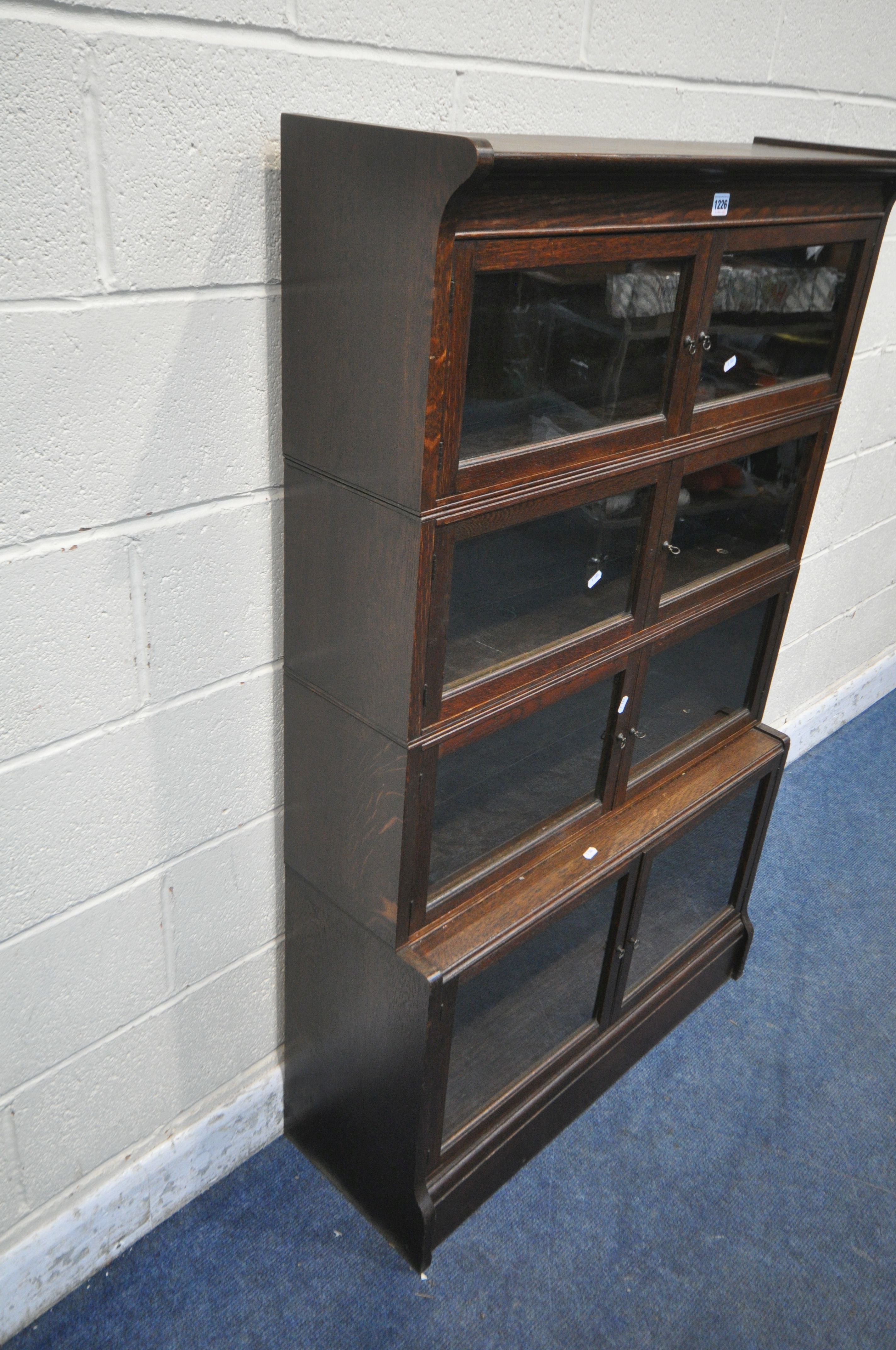 W M BAKER AND CO, OXFORD, AN EARLY 20TH CENTURY OAK SECTIONAL BOOKCASE, with one deep bottom section - Image 2 of 6