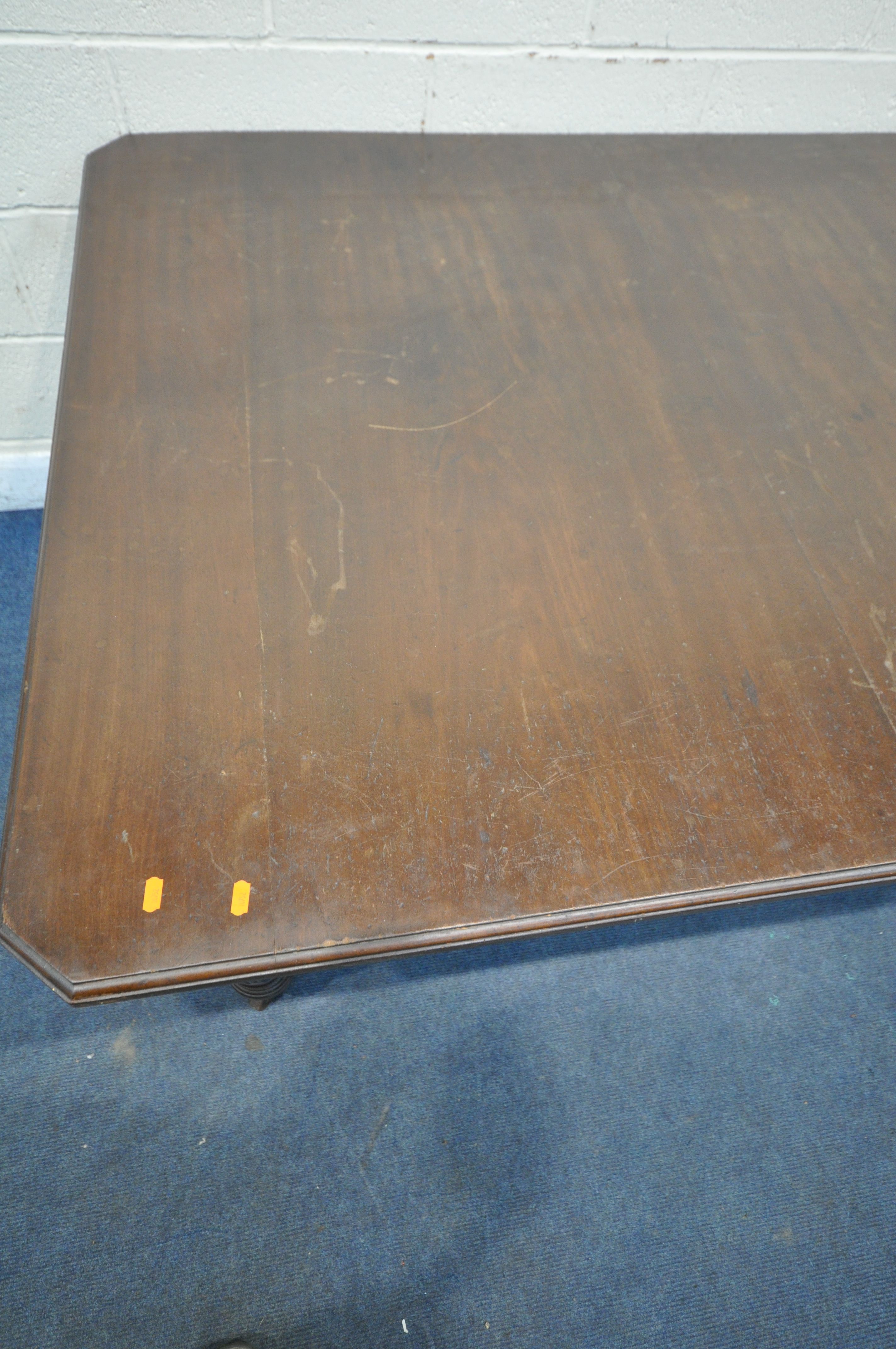 A VICTORIAN WIND OUT DINING TABLE, with canted corners, raised on turned and reeded legs, with - Image 2 of 4
