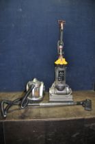 A DYSON DC 33 MULTI FLOOR UPRIGHT VACUUM CLEANER and a Delta Vacuum cleaner (both PAT pass and