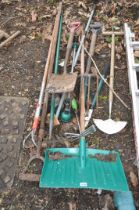 A COLLECTION OF GARDEN TOOLS including a snow shovel, spades, forks, etc (10+)