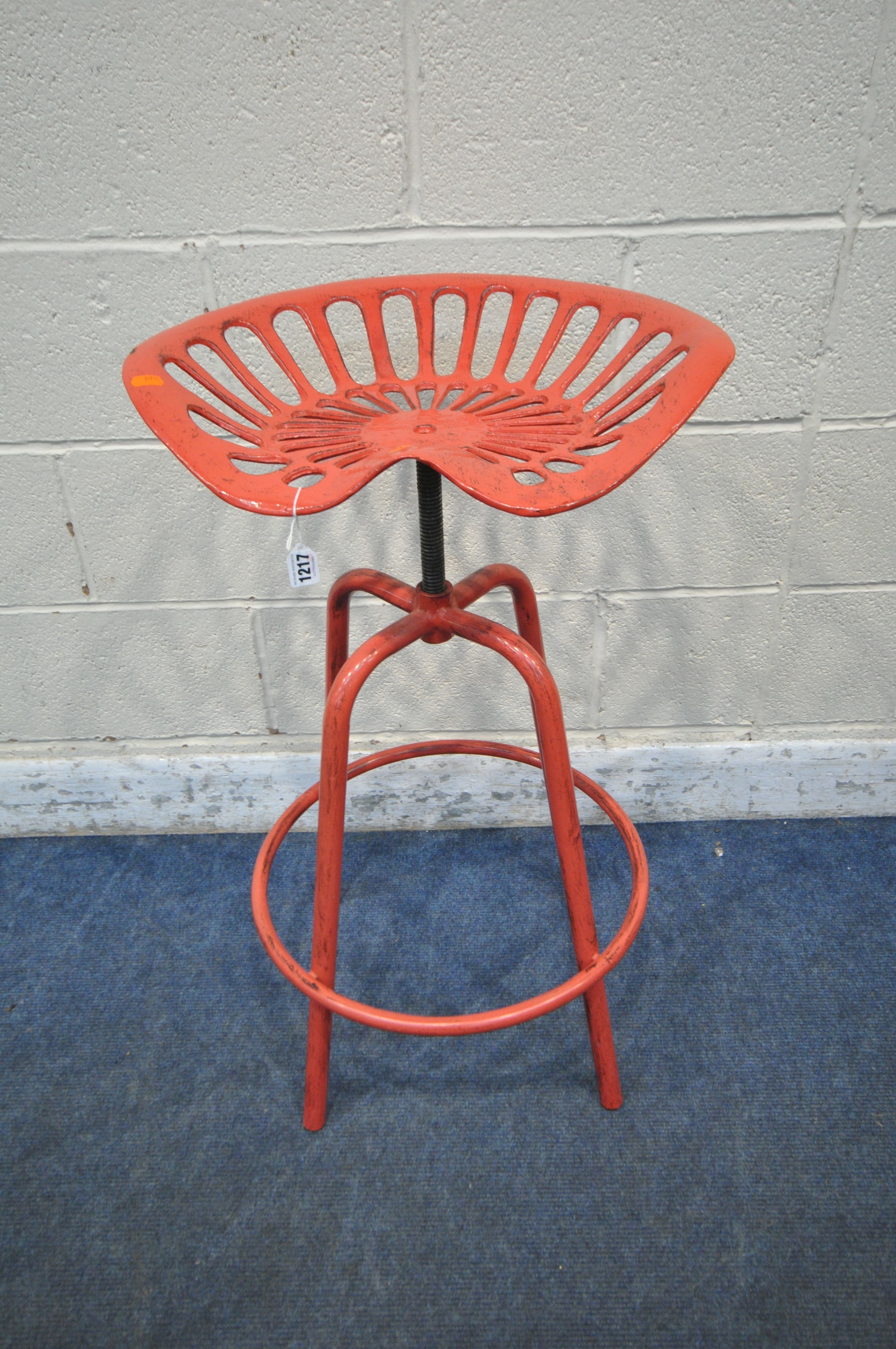 A RED PAINTED REPRODUCTION CAST ALUMINIUM TRACTOR SEAT STOOL, with swivel height adjusting seat,
