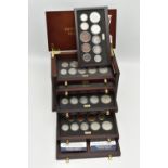 A SMALL WOODEN COIN CABINET, consisting of eight drawers seven containing UK coinage from 1939-1945,