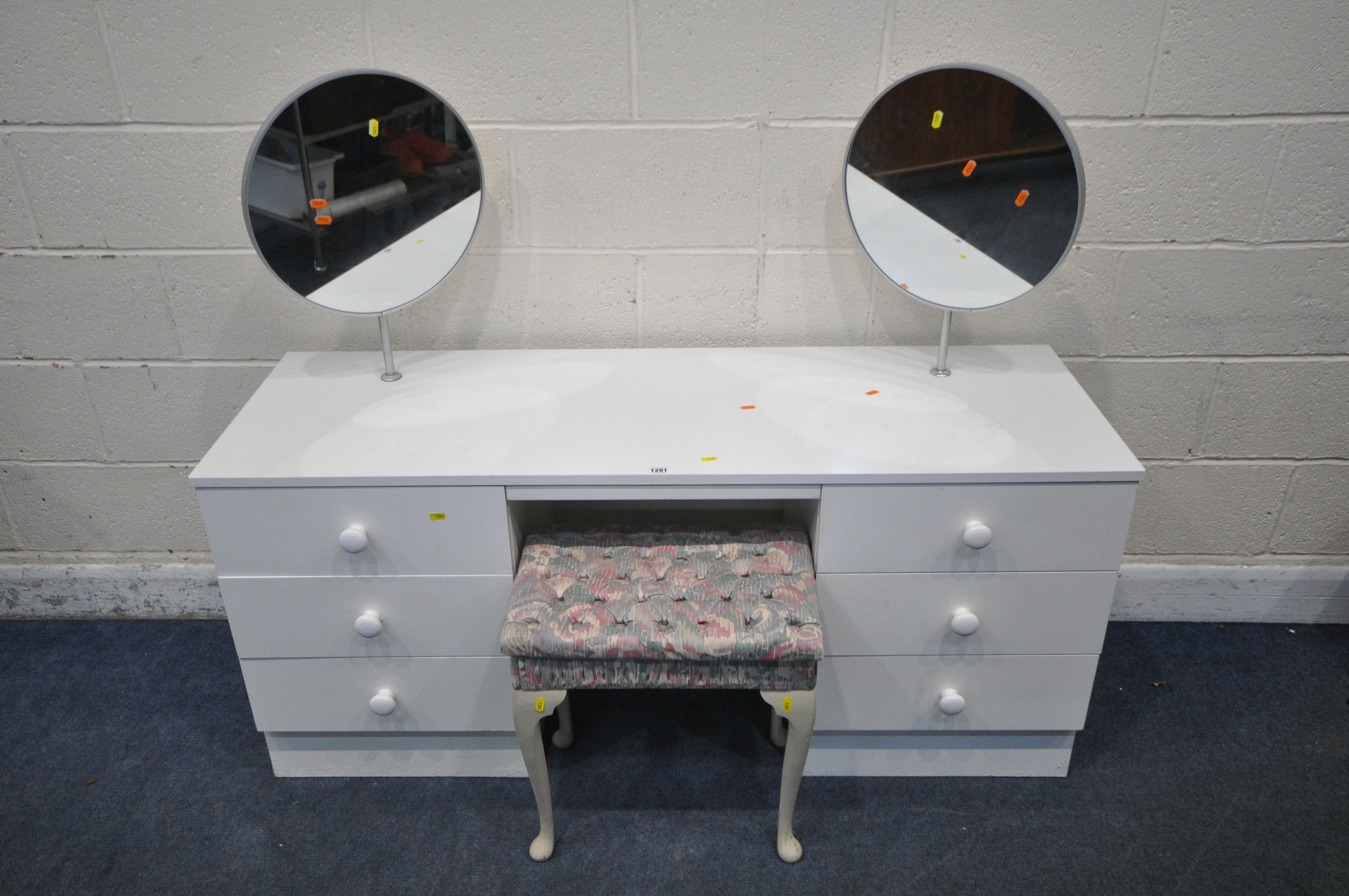 A WHITE DRESSING TABLE, with two circular mirrors and two banks of three drawers, length 146cm x