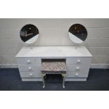 A WHITE DRESSING TABLE, with two circular mirrors and two banks of three drawers, length 146cm x