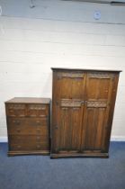 A 20TH CENTURY OAK TWO PIECE BEDROOM SUITE, comprising a double door wardrobe, with floral and