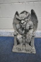 A MODERN COMPOSITE GROTESQUE, seated on a throne width 30cm x depth 20cm x height 48cm (condition-