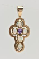 A 9CT GOLD AMETHYST AND SYNTHETIC OPAL CROSS PENDANT, set centrally with an oval cut amethyst, and