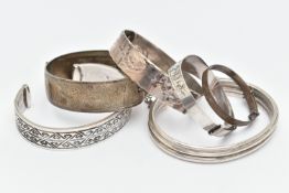 SIX BRACELETS, to include a silver cuff bangle with Aztec pattern, hallmarked London, a silver