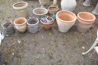 FIVE TERRACOTTA PLANT POTS, two small glazed pots, a metal bucket, etc, the largest pot being 43cm