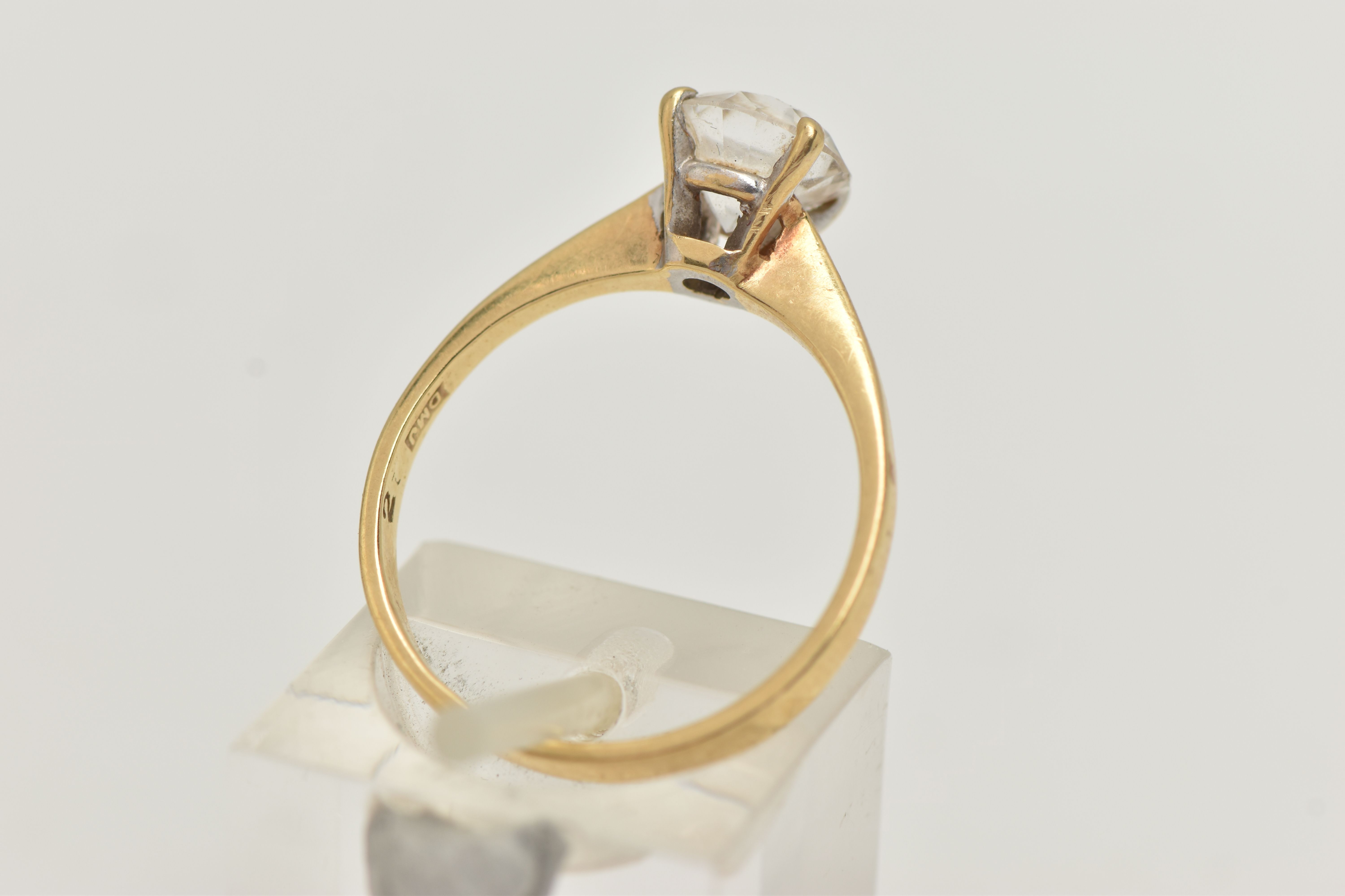 A YELLOW METAL TOPAZ RING, set with a circular cut colourless topaz, in a four claw setting, pinched - Image 3 of 4