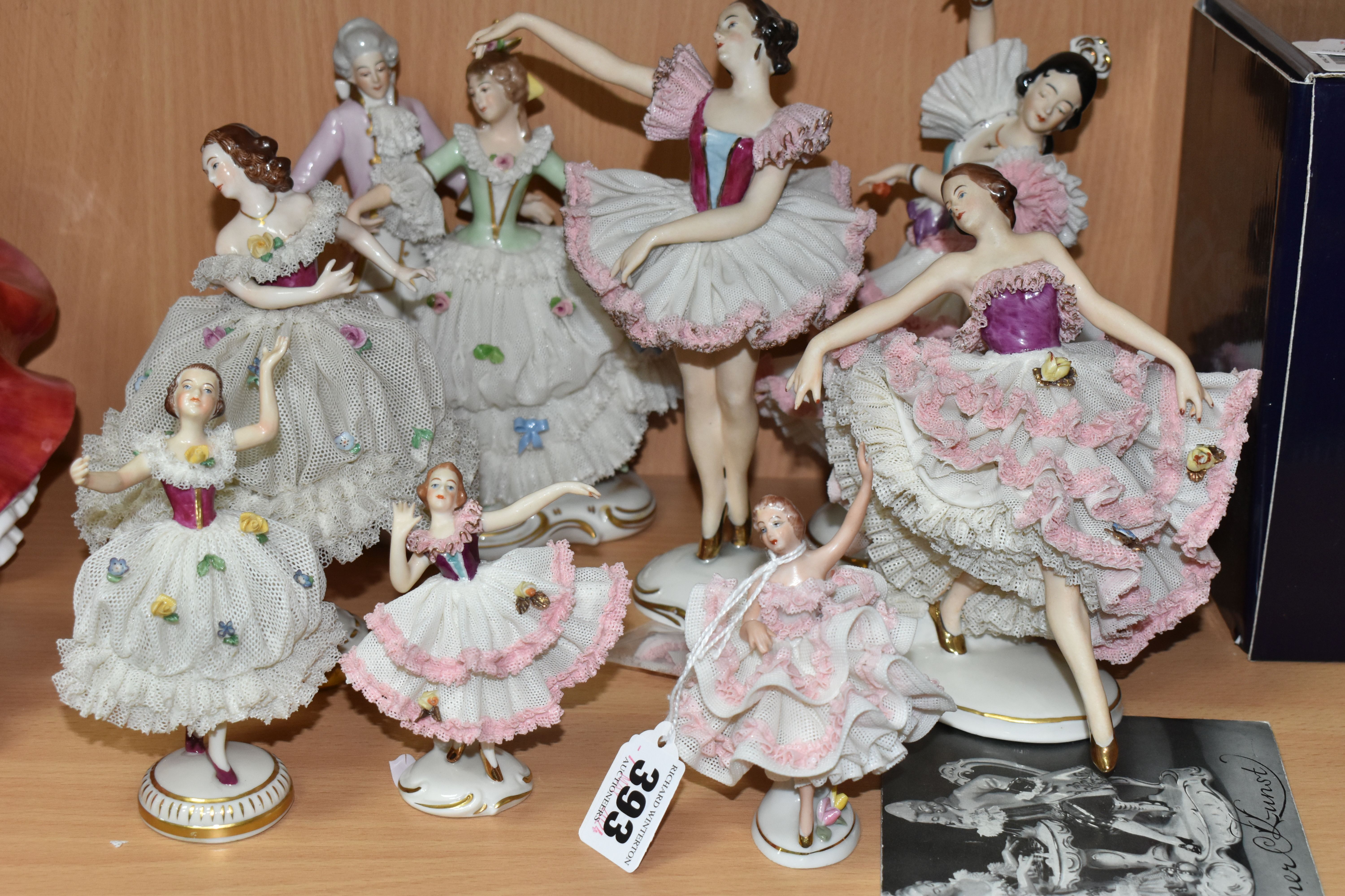 EIGHT DRESDEN FIGURES, with lace skirts, to include a figure group, flamenco, ballet and other