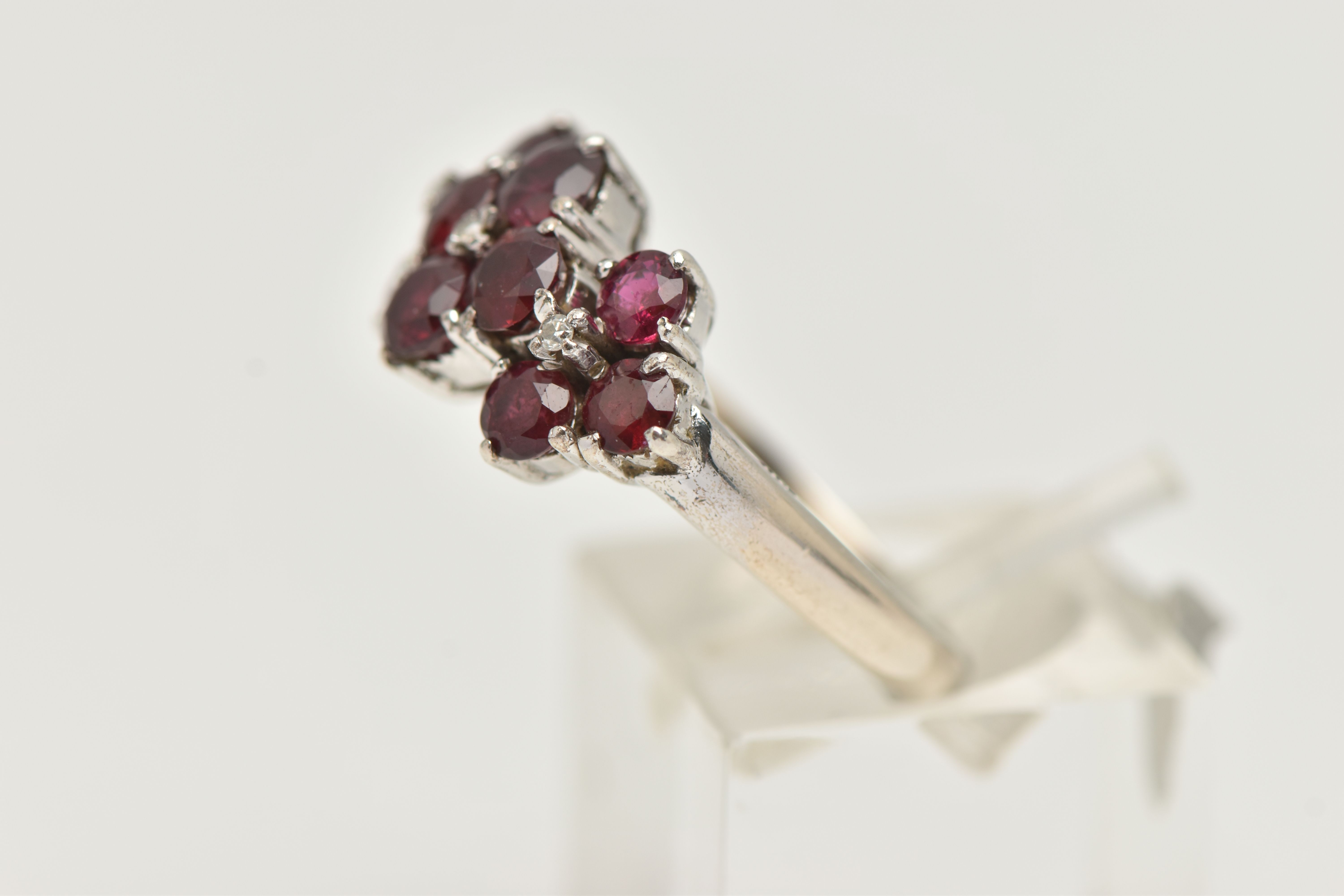A WHITE METAL RUBY AND DIAMOND DRESS RING, set with ten circular cut rubies, each claw set, with - Image 2 of 4