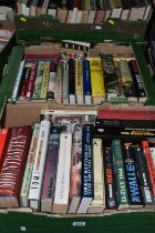 FOUR BOXES OF BOOKS, approximately eighty to one hundred titles in hardback and paperback formats,