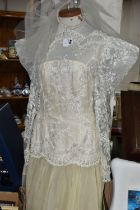 A DROP WAISTED 1980's STYLE CREAM/CHAMPAGNE COLOURED WEDDING DRESS WITH TUILLE UNDERSKIRT,