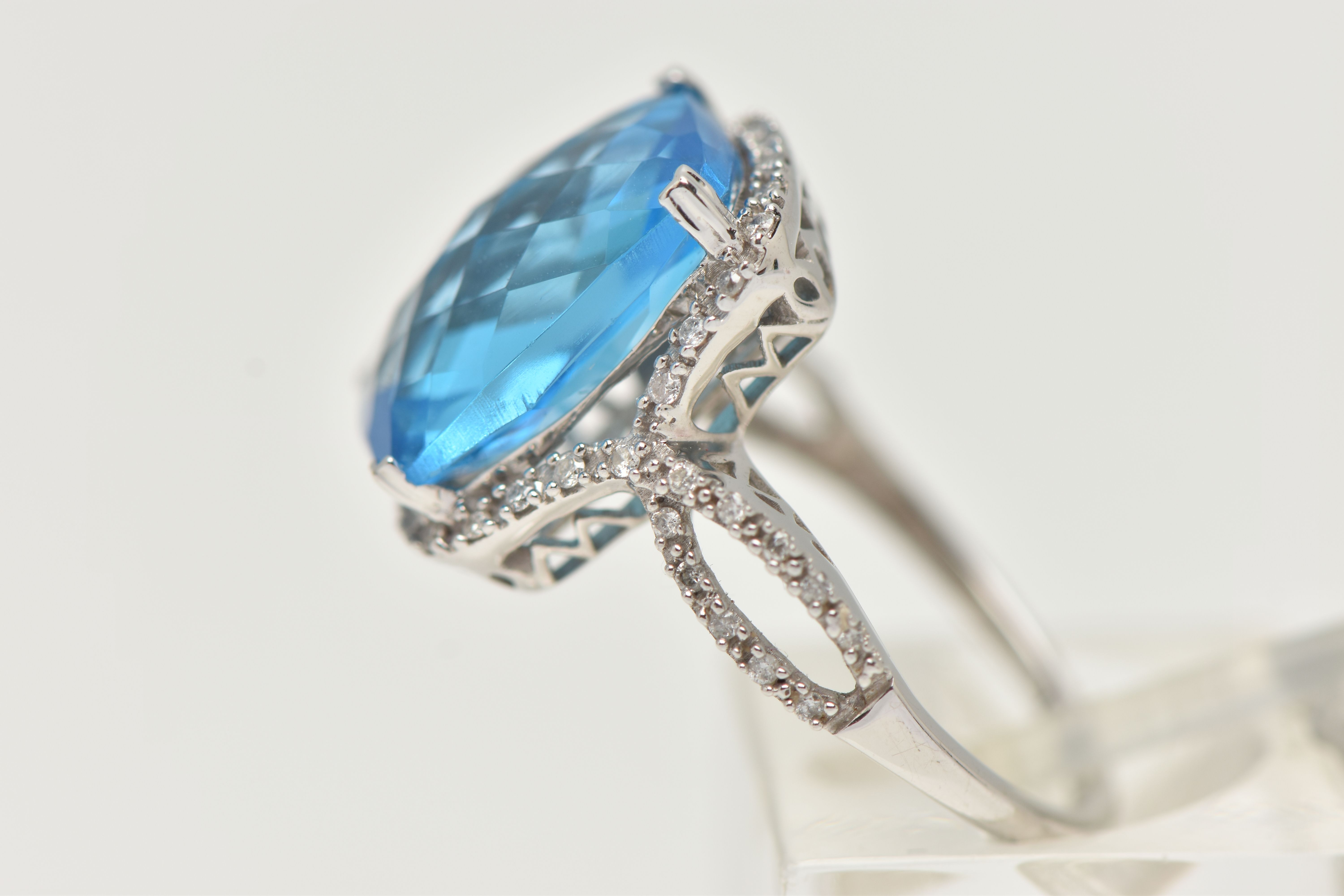 A 'KALLATI' TOPAZ AND DIAMOND DRESS RING, a large rectangular cut blue topaz, approximate length - Image 2 of 4