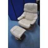 AN EKORNES STRESSLESS CARAMEL LEATHER UPHOLSTERED RECLINING ARMCHAIR, along with a footstool (