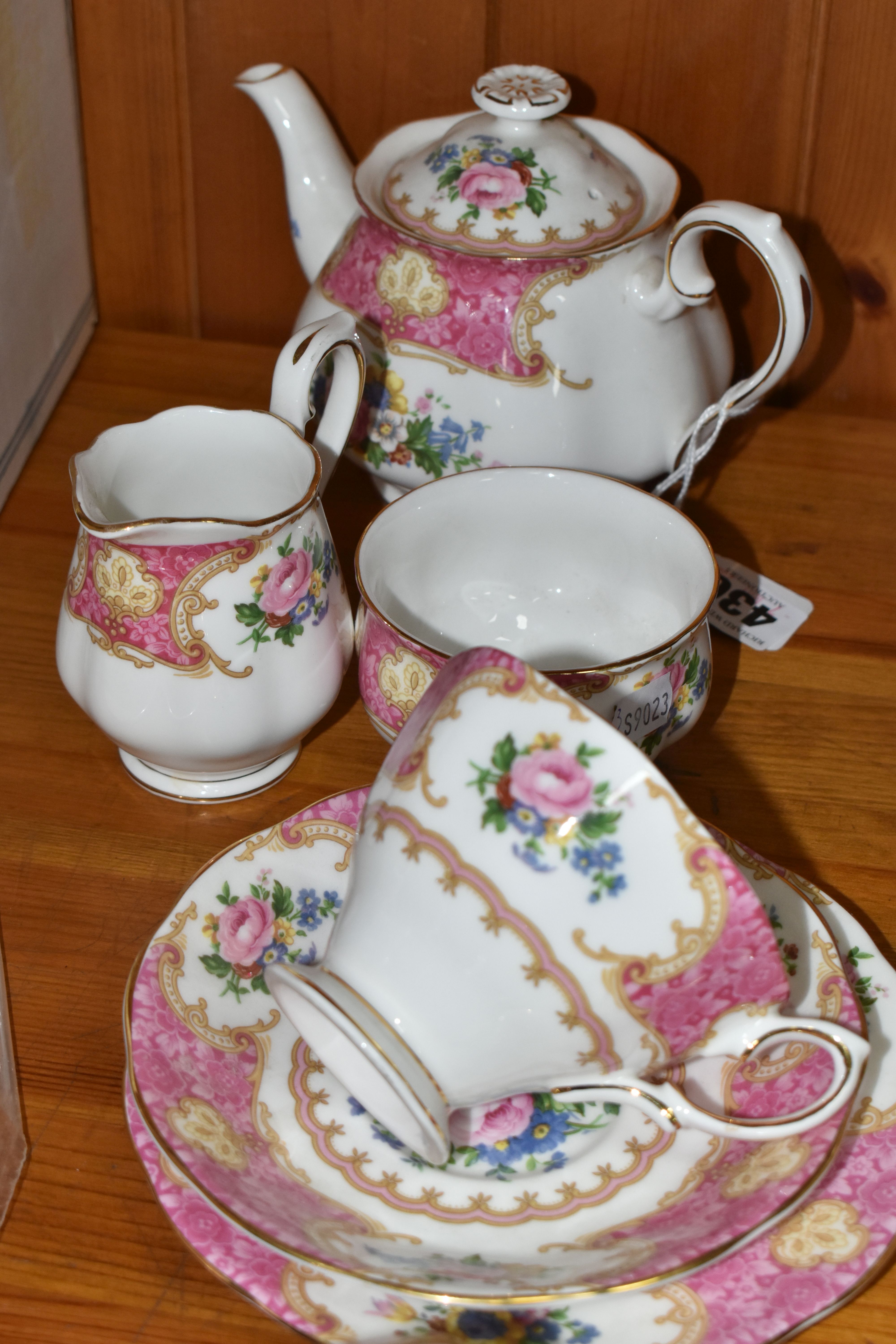 A ROYAL ALBERT 'LADY CARLYLE' PATTERN TEA SET FOR TWO, comprising a small teapot, milk jug, sugar