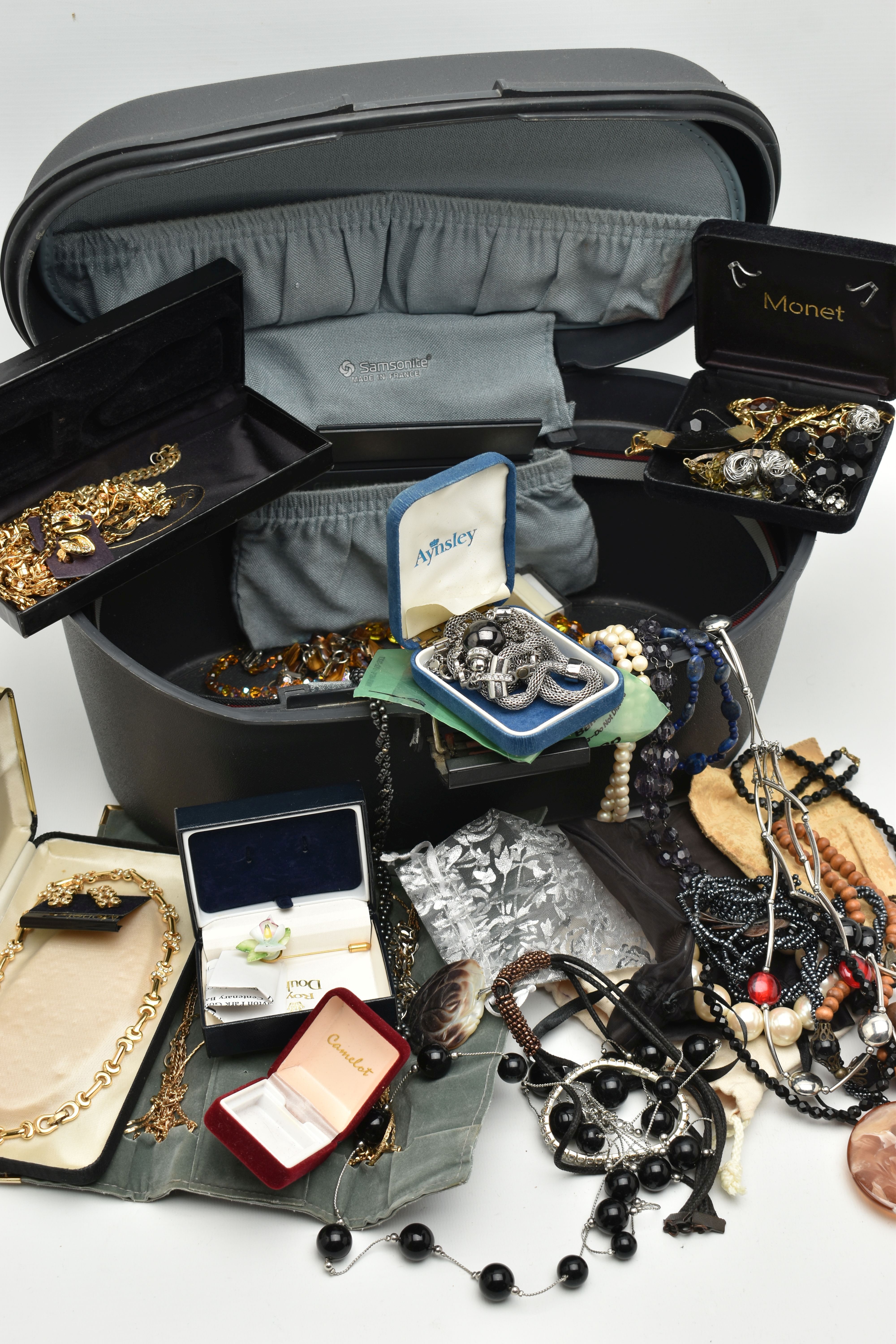 A STORAGE BOX WITH COSTUME JEWELLERY, to include a boxed 'Monet' gold tone and paste set necklace