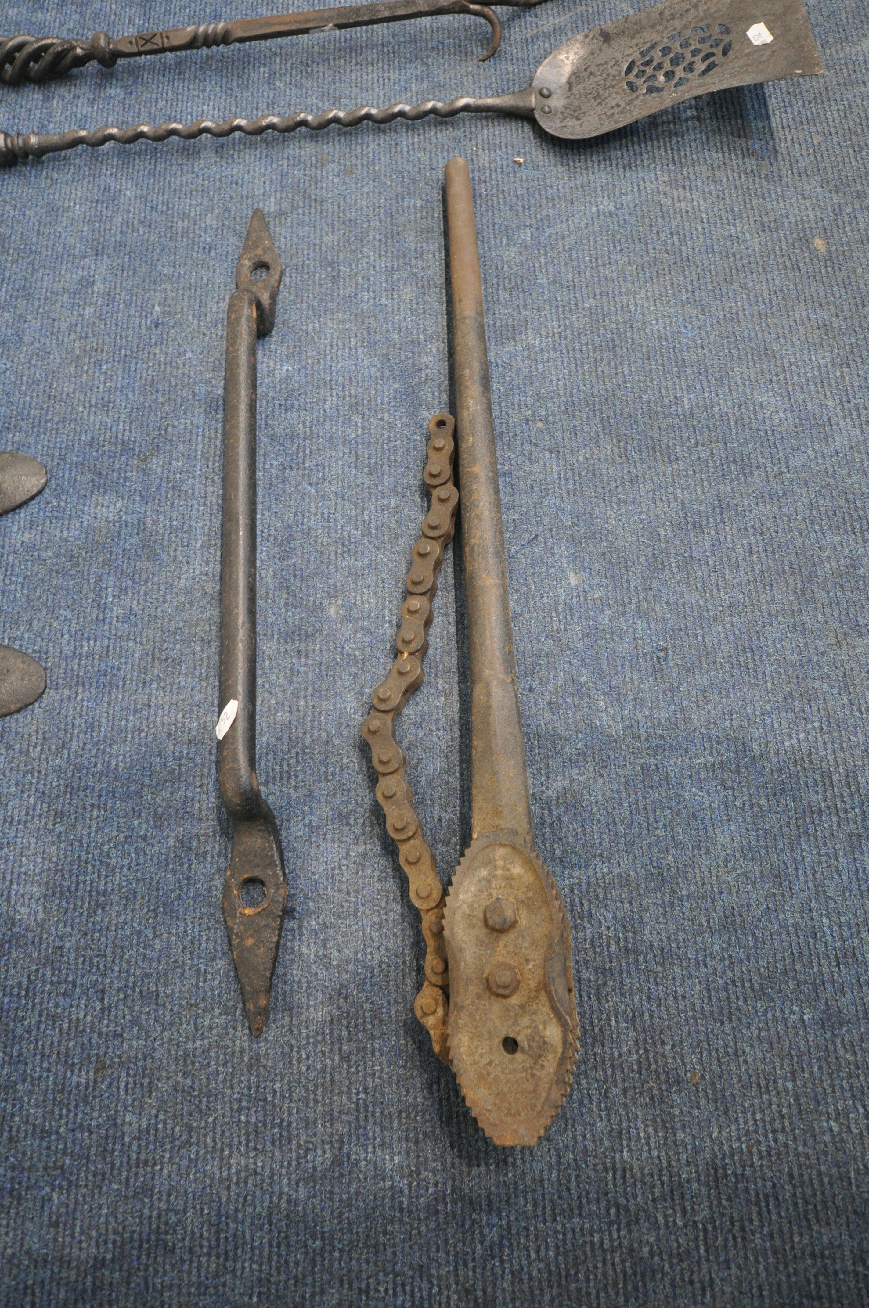 A PAIR OF VICTORIAN CAST IRON ANTI CLIMB SPIKES, a door handle, a chain pipe wrench, along with four - Image 3 of 4