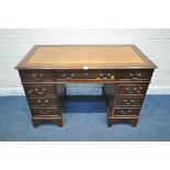 A 20TH CENTURY MAHOGANY TWIN PEDESTAL DESK, with a tanned leather writing surface, and an