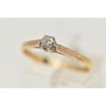 A YELLOW METAL DIAMOND SINGLE STONE RING, set with a round brilliant cut diamond, claw set,