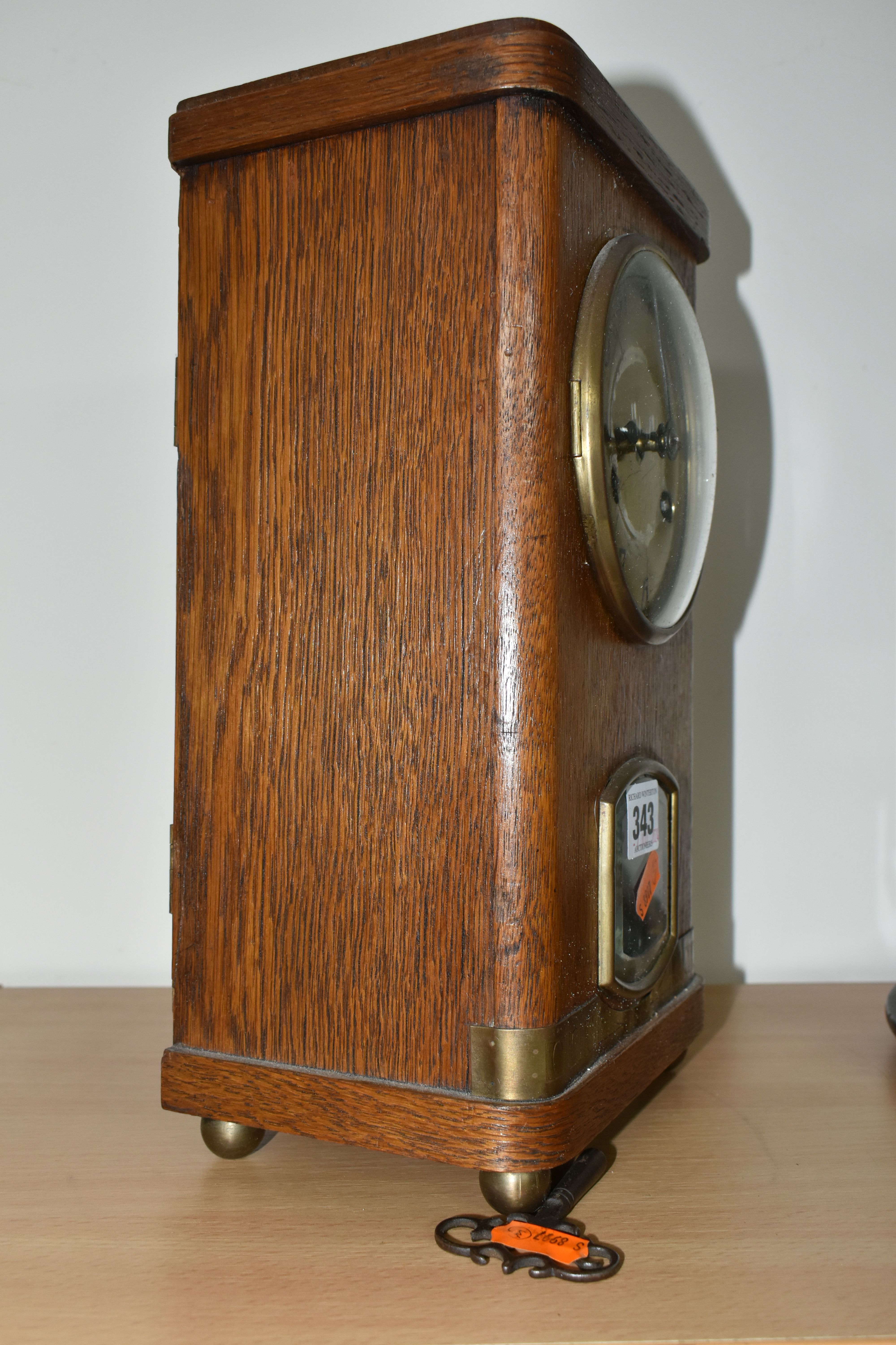 A JUNGHANS TABLE CLOCK, a plane oak case, striking gong, half hour and hour, supported by four - Image 3 of 5