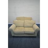 A PAIR OF BEIGE UPHOLSTERED TWO SEATER SOFAS, length 180cm x depth 94cm x height 84cm (condition