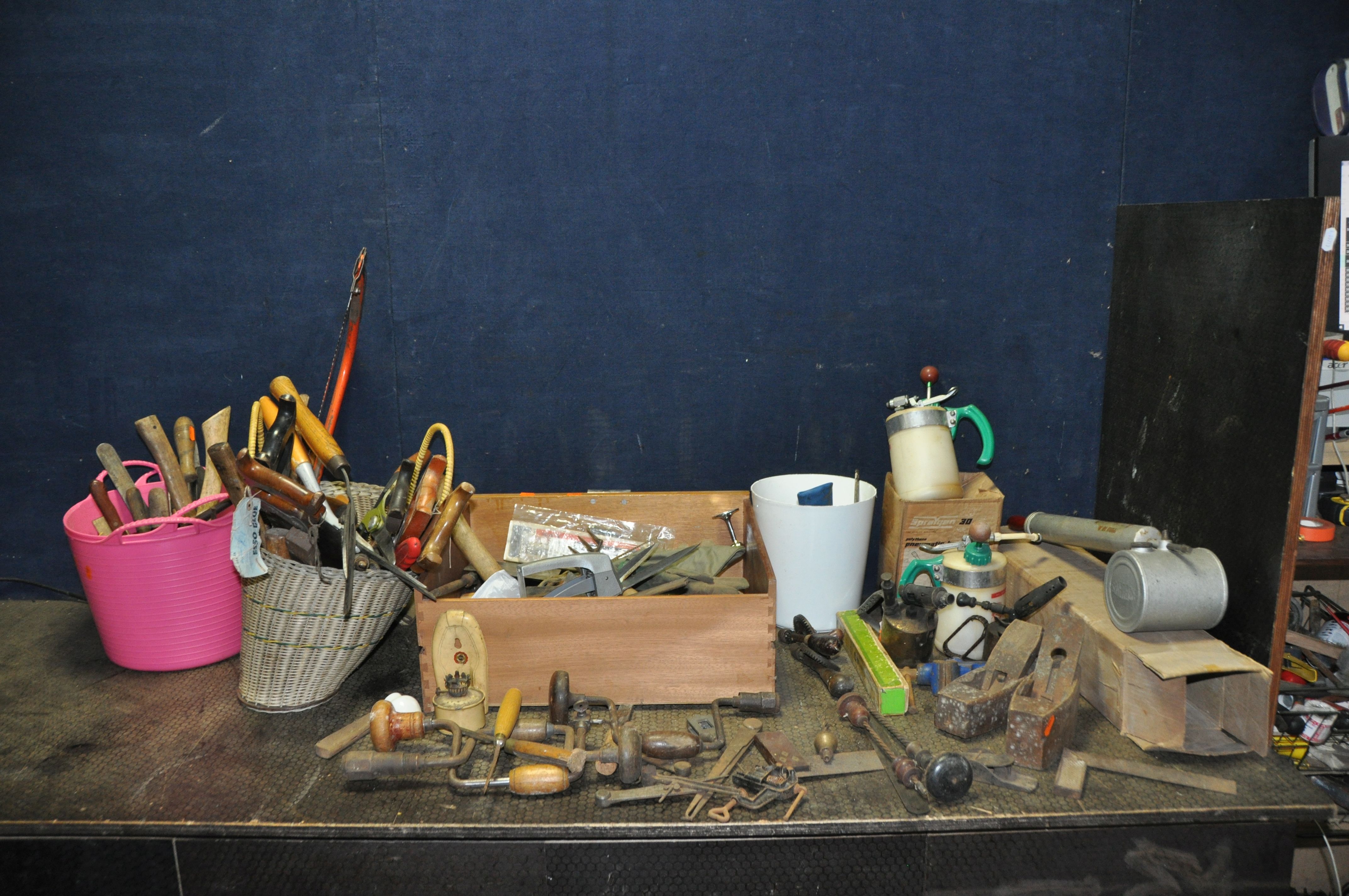 A DRAWER AND TWO BASKETS CONTAINING TOOLS including Pin drills, braces, hand drill, coffin planes,