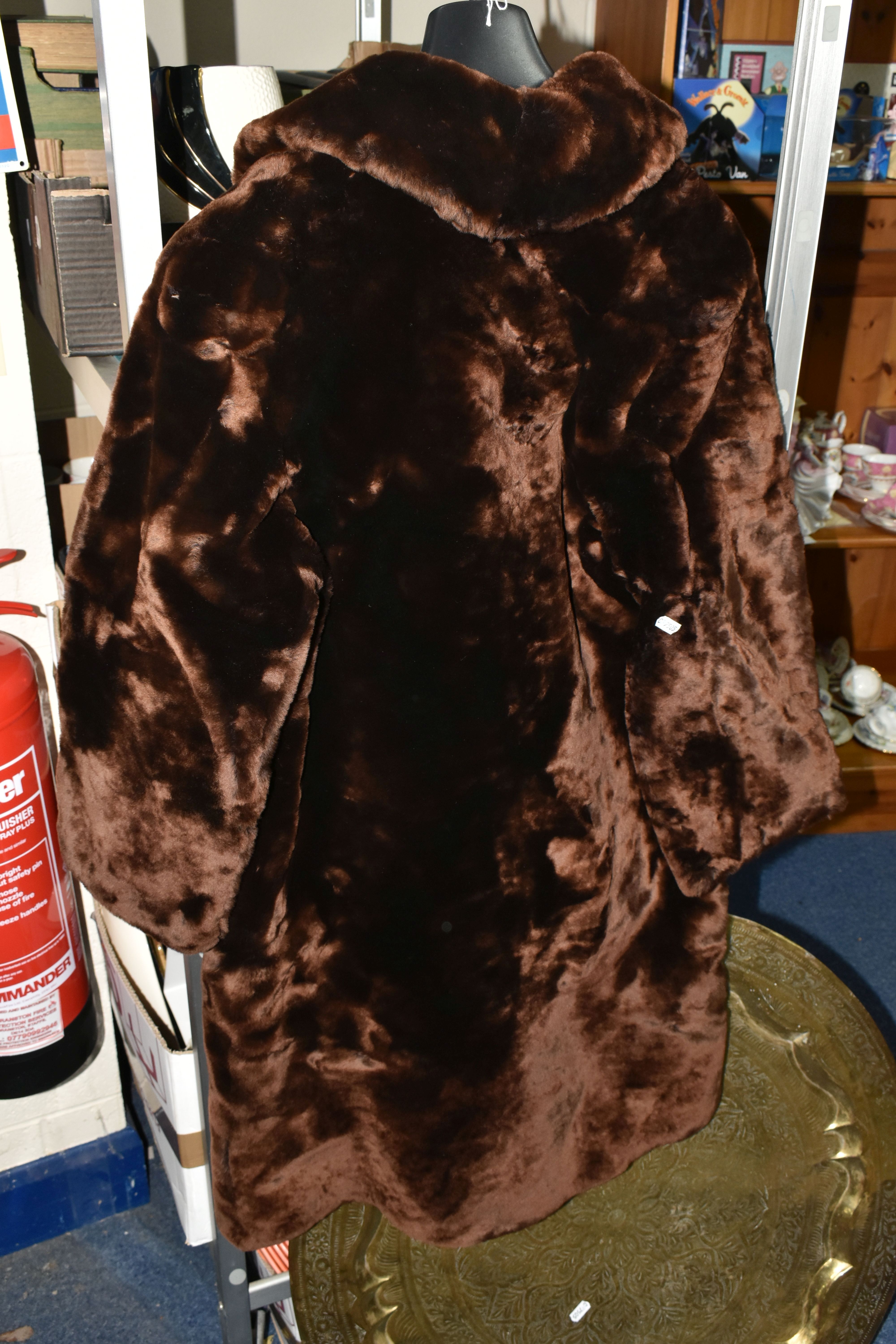 TWO BOXES OF BOOKS AND SUNDRIES, to include a vintage brown faux fur coat, large brass circular - Image 8 of 10