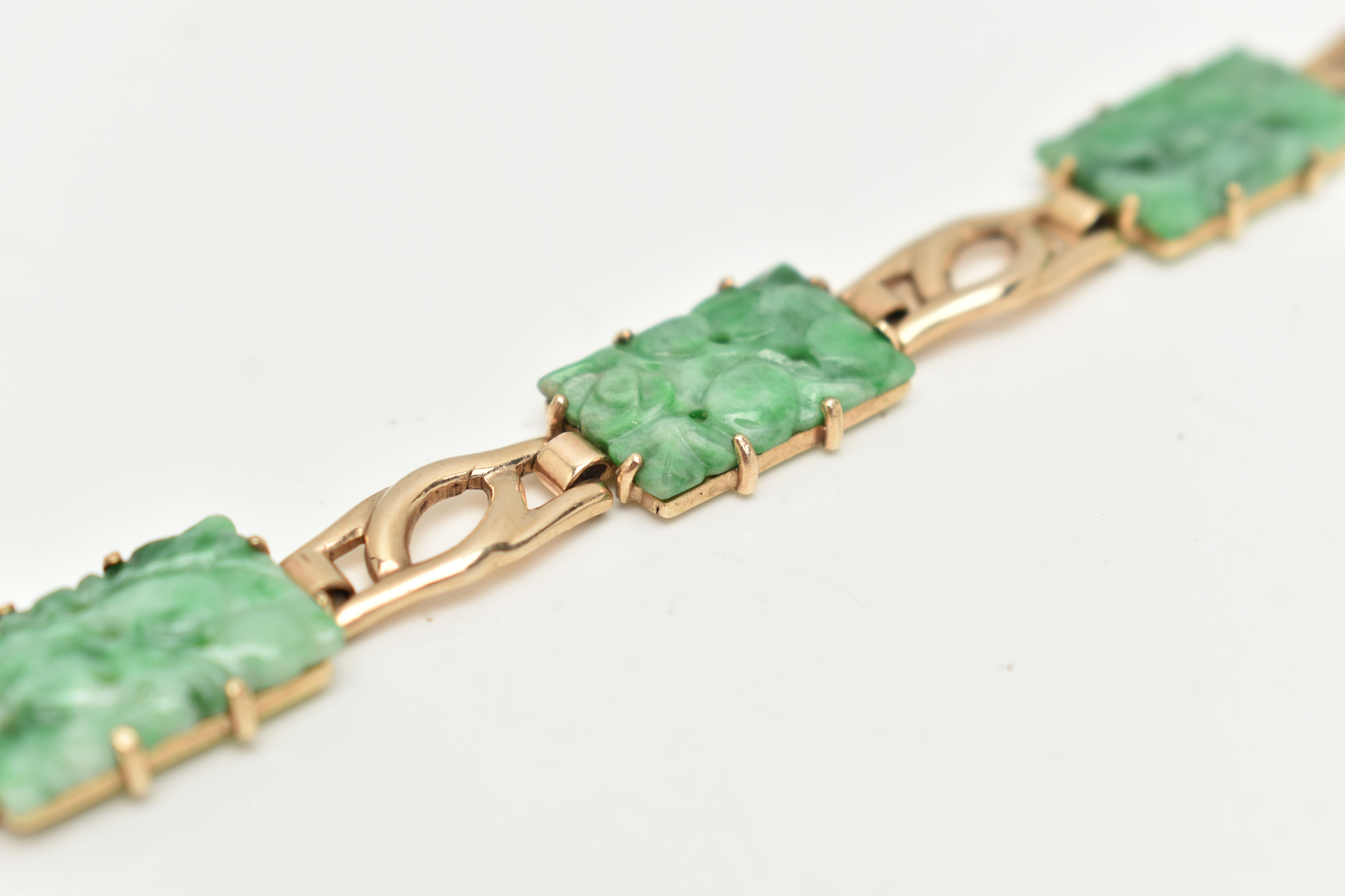 A 9CT GOLD JADE PANEL BRACELET, the rectangular jade panels carved to depict fruits and foliage, - Image 5 of 5