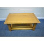 A LIGHT OAK RECTANGULAR COFFEE TABLE, raised on block legs, united by an undershelf, width 120cm x